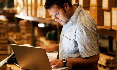 Image of a wholesale distribution employee using a system needing an ERP upgrade